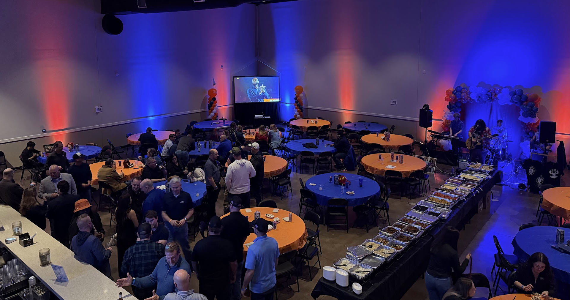 Corporate event with full-room color uplighting