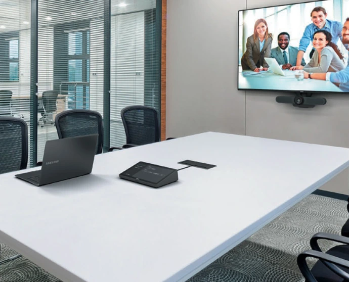 Conference room with video display and table microphones