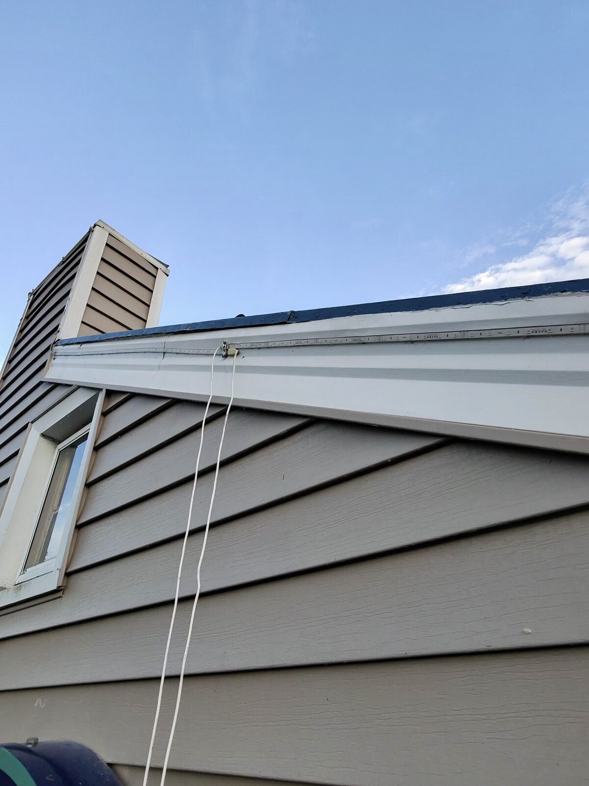 Previous installer's loose wires hanging from the eave at Cozy's