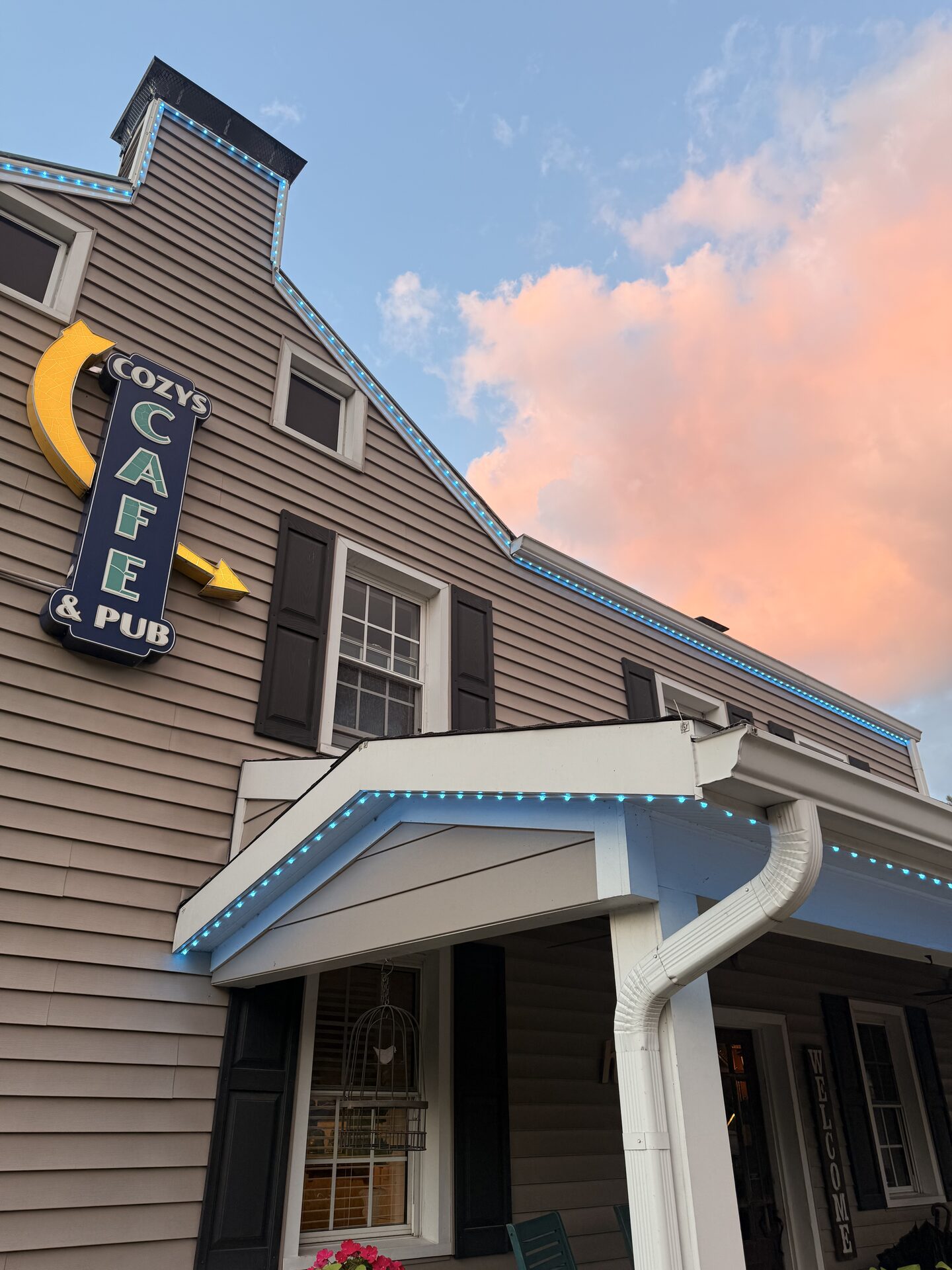The same Cozy's roofline in daylight with the lights on