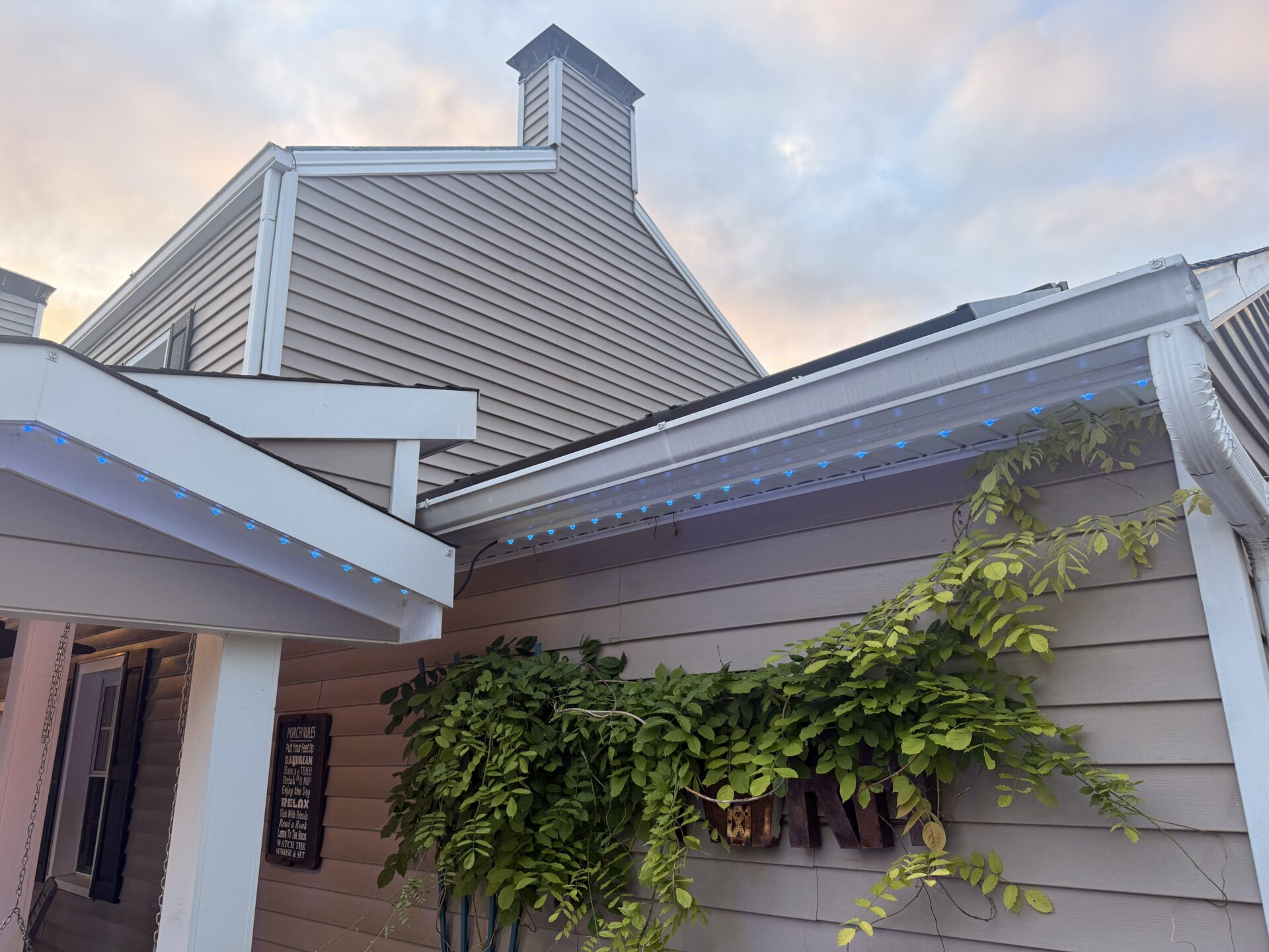 Daytime view of the Cozy's Cafe and Pub roofline with permanent lighting installed